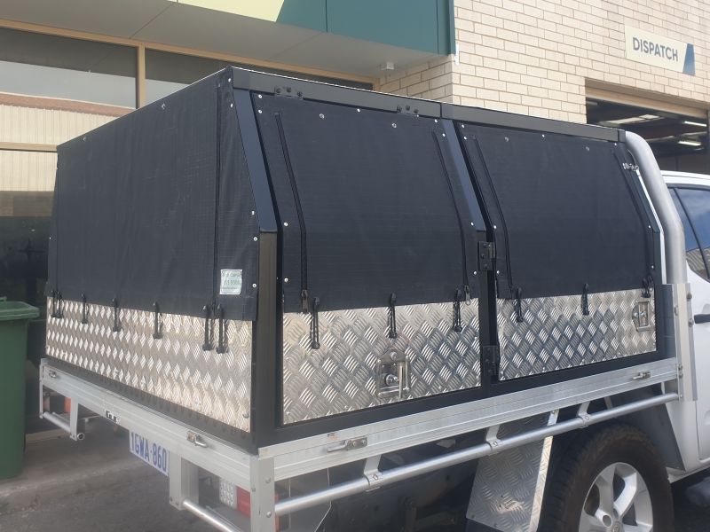 Unique custom canvas ute canopy with dual zips and cage.