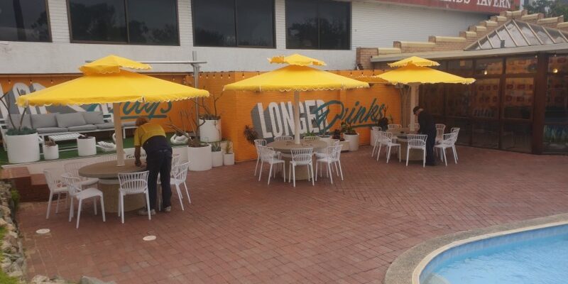 Fabric repair of Unbrellas in commercial venue.