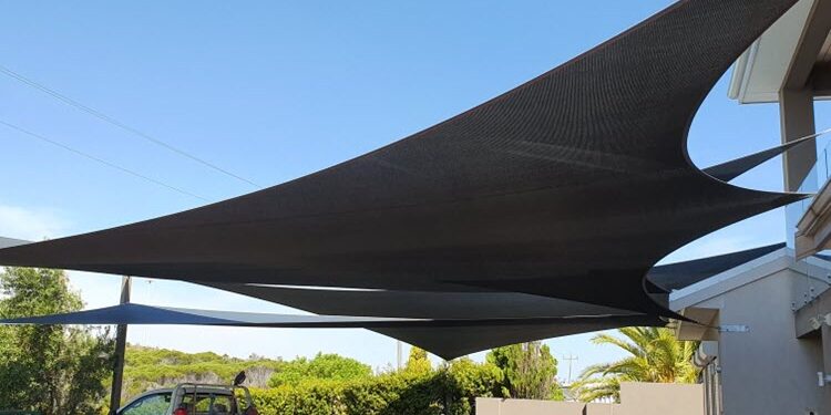 black shade sail installation.