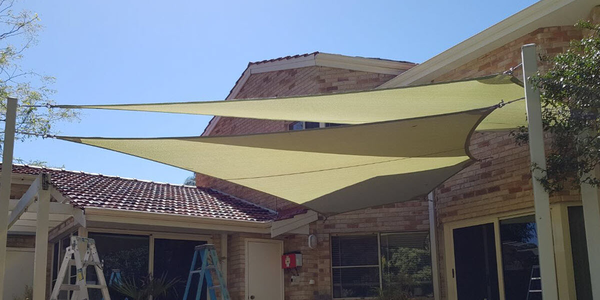 Multiple outdoor alfesco shade sails.